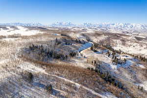 Snowy aerial view with a mountain view