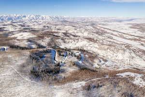 Snowy aerial view with a mountain view