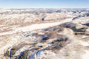 Snowy aerial view featuring a mountain view