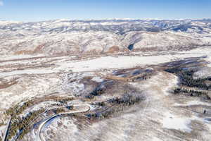 Snowy aerial view with a mountain view