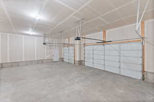 Garage featuring a garage door opener