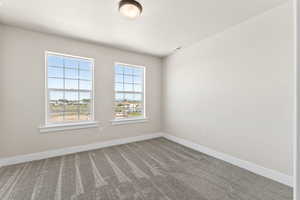 Unfurnished room with carpet floors