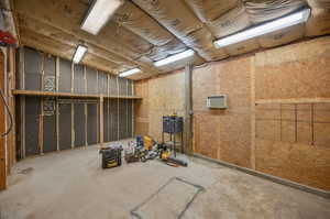 Interior space workshop or garage with wall a/c unit