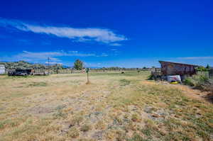 View of yard with a rural view