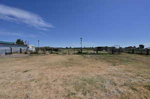 View of yard with a rural view