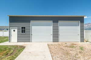 View of garage 26'X35' with a two post car lift.