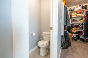 Bathroom with tile patterned flooring and toilet