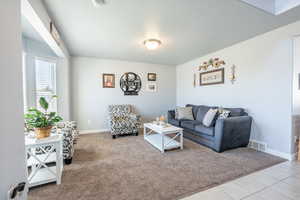 Living room featuring light tile patterned floors