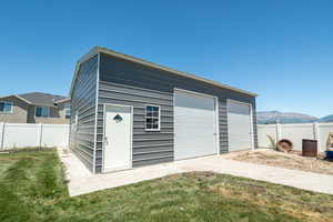 Garage with a yard and a mountain view