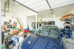 Garage featuring a garage door opener