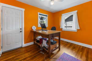 Office area featuring ceiling fan and dark hardwood / wood-style floors