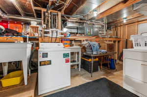 Basement featuring a workshop area and washer / clothes dryer