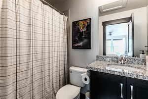 Bathroom with toilet and vanity