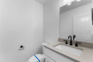 Bathroom with toilet and vanity