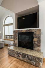 Details featuring hardwood / wood-style floors and a fireplace