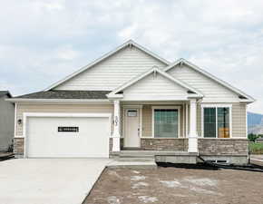 Craftsman house featuring a garage