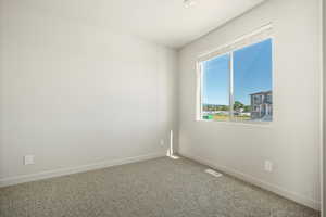 Empty room featuring carpet floors