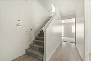 Stairs featuring light hardwood / wood-style floors