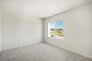 Empty room featuring carpet floors