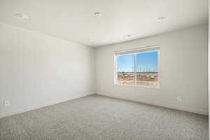 View of carpeted spare room