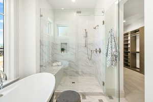 Primary Bathroom with independent shower and bath and tile floors