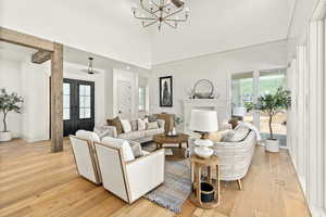 Living room featuring a chandelier and light hardwood / wood-style floors