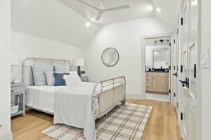 Accessory Apartment Bedroom with lofted ceiling, ceiling fan, and light hardwood / wood-style flooring