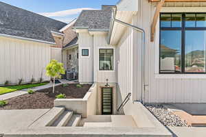 Entrance to property with central AC unit