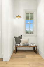 Sitting room with light hardwood / wood-style floors