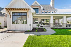 Exterior space with a front lawn and a porch