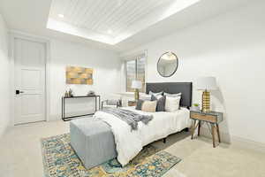 Lower Level Bedroom with a raised ceiling and light colored carpet