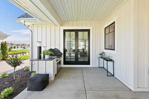 Property entrance with french doors and a patio