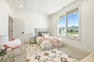 Bedroom with carpet and multiple windows