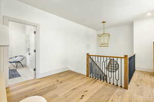 Interior space featuring light hardwood / wood-style floors and a notable chandelier