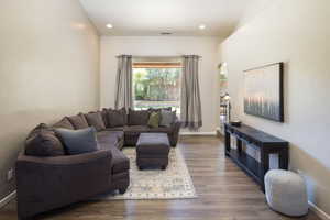 Living room featuring dark hardwood / wood-style flooring