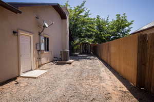 Exterior space with central AC unit and a shed