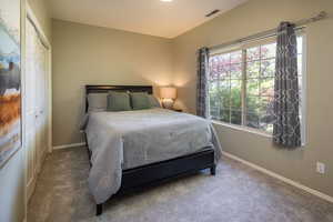 Bedroom featuring a closet and carpet floors