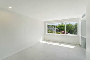 Spare room featuring light tile flooring