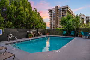 View of pool at dusk