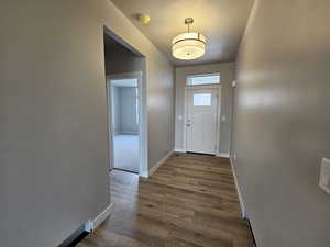 Doorway to outside with carpet flooring