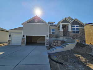 Craftsman-style house featuring a garage