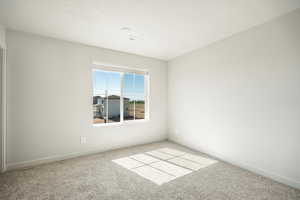 Empty room featuring carpet floors