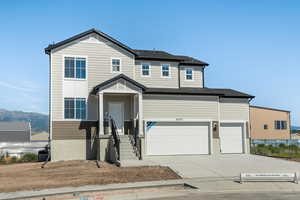 View of property with a garage