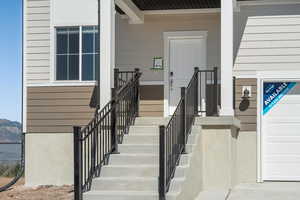 View of exterior entry featuring a mountain view