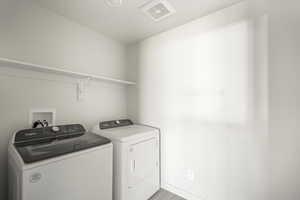 Laundry area featuring washing machine and clothes dryer