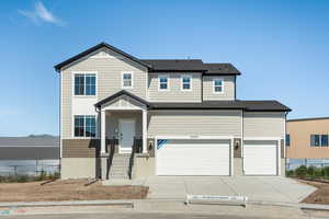 View of front of property featuring a garage