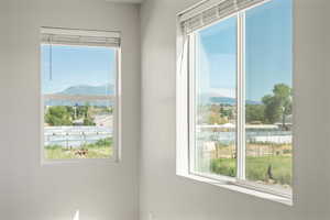 Spare room with plenty of natural light and a mountain view