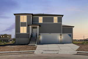 View of front of home with a garage