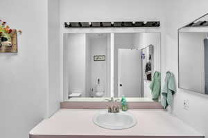 Bathroom with vanity and toilet