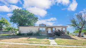 View of front facade with a front yard